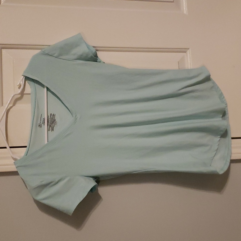 Blue Nobo shirt with short sleeves.